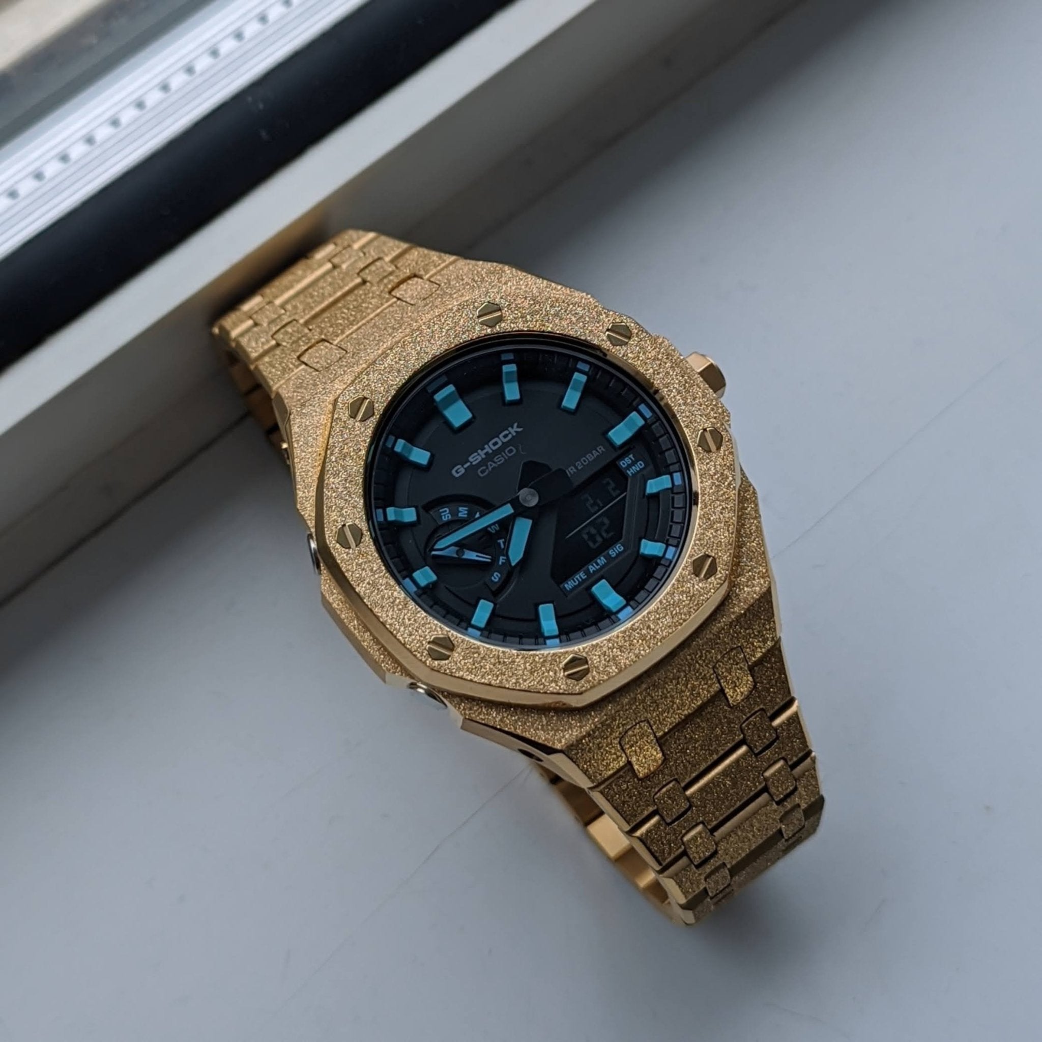 Which G-Shock Mod is Perfect for You? Exploring the Frosted Gold, Silver, and Black Casioak Options - Q Wrist - Modified Watches